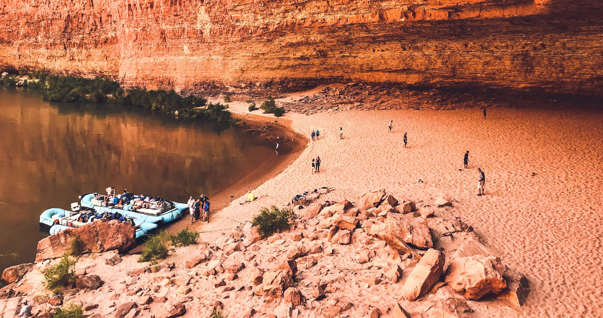 Beach scene with boats and people